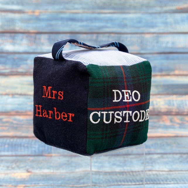 Fabric doorstop made from scraps of school uniform. Can be personalised with any details, an ideal teacher appreciation gift